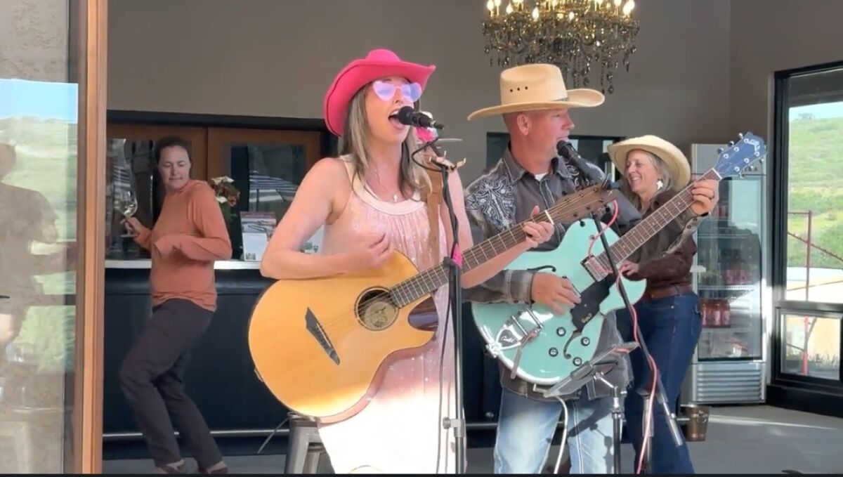 As part of the video for her new single, Ashley E. Norton was joined by Micole Moore of Ramona Ranch Winery, playing guitar.