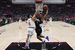 Los Angeles Clippers forward Kawhi Leonard (2) shoots against New York Knicks guard Quentin Grimes (6) during the first half of an NBA basketball game in Los Angeles, Saturday, Dec. 16, 2023. (AP Photo/Ashley Landis)