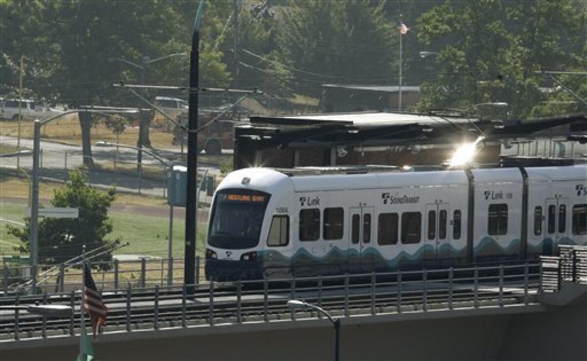 Sun reflects off of a Sound Transit light-rail train in Seattle. The rail line runs from downtown Seattle to near the Seattle-Tacoma International Airport.