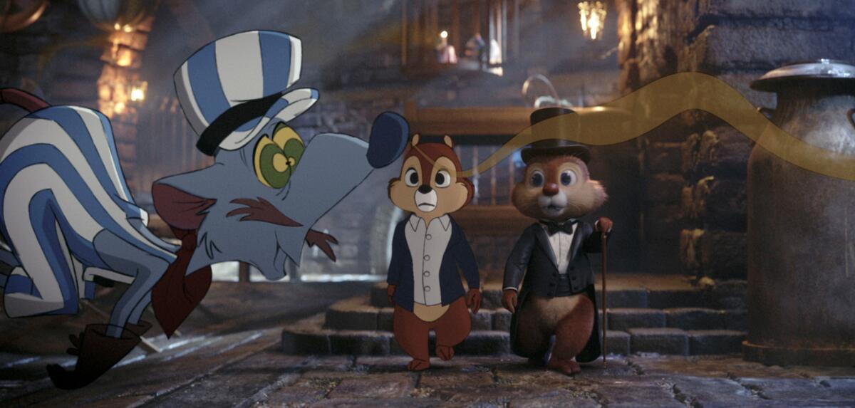 This image released by Disney+ shows Chip, voiced by John Mulaney, center, and Dale, voiced by Andy Samberg, right, in a scene from "Chip ‘n Dale: Rescue Rangers." (Disney Enterprises via AP)