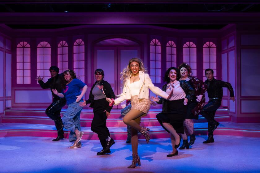 Johnisa Breault, center, leads a dance number in San Diego Musical Theatre's "Legally Blonde."