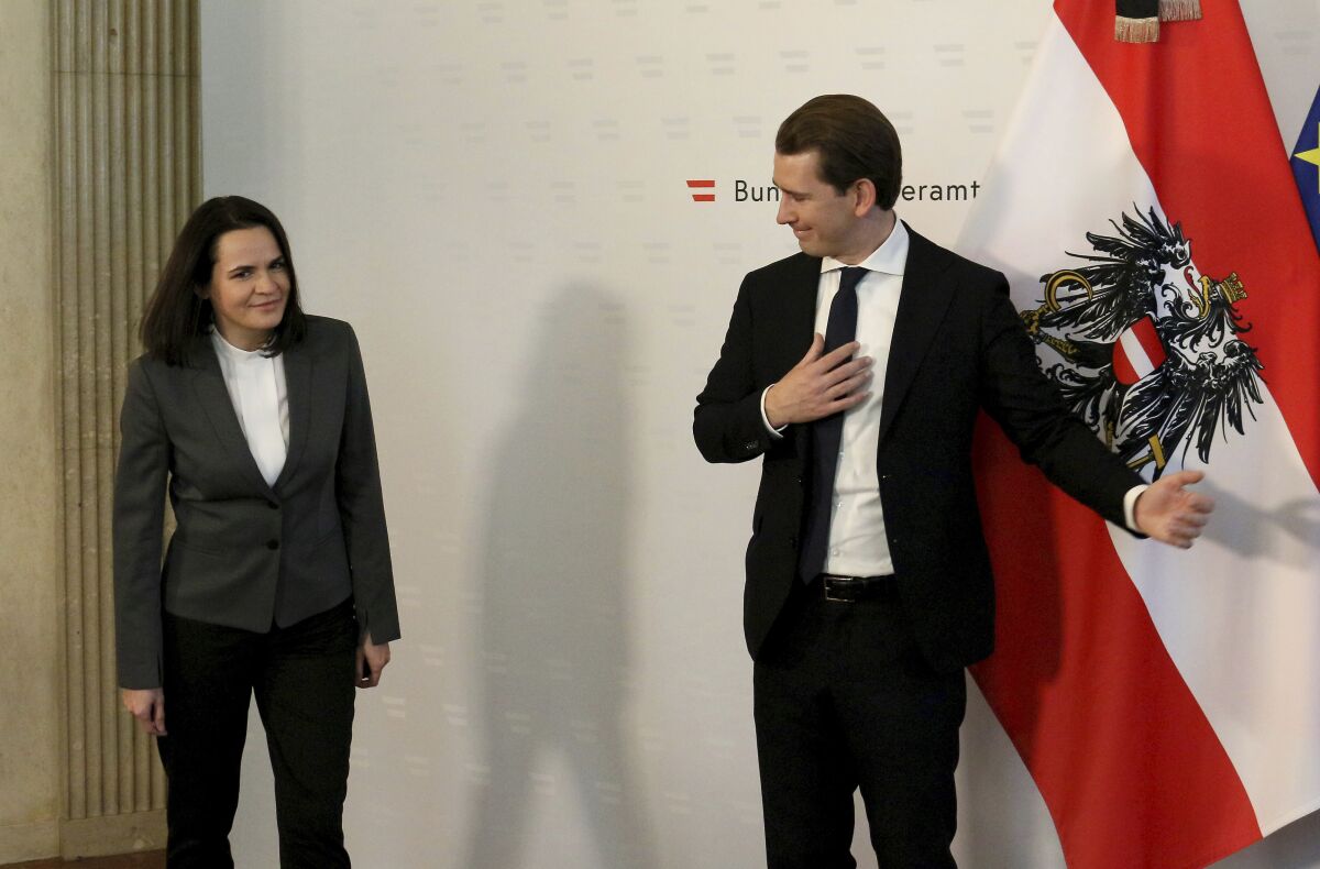 Austrian Chancellor Sebastian Kurz, right, welcomes Belarusian opposition leader Svetlana Tikhanovskaya before a meeting at the federal chancellery in Vienna, Austria, Thursday, Nov. 5, 2020. (AP Photo/Ronald Zak)