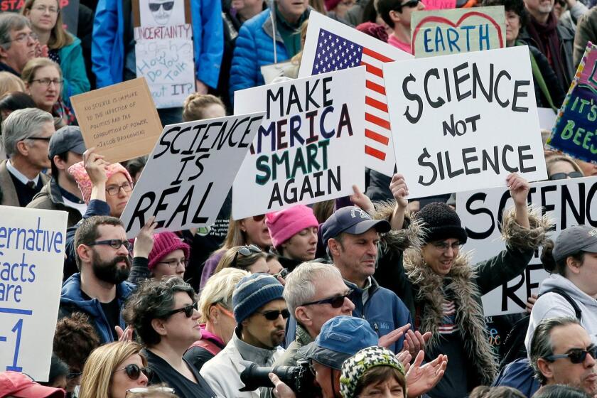 Members of the scientific community, environmental advocates, and supporters demonstrate Sunday, Feb. 19, 2017, in Boston, to call attention to what they say are the increasing threats to science and scientific research under the administration of President Donald Trump. (AP Photo/Steven Senne)