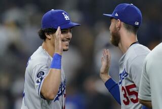 Los Angeles Dodgers left fielder Miguel Vargas, left, celebrates with center fielder Cody Bellinger after the Dodgers defeated the San Diego Padres 5-2 in a baseball game Thursday, Sept. 29, 2022, in San Diego. (AP Photo/Gregory Bull)