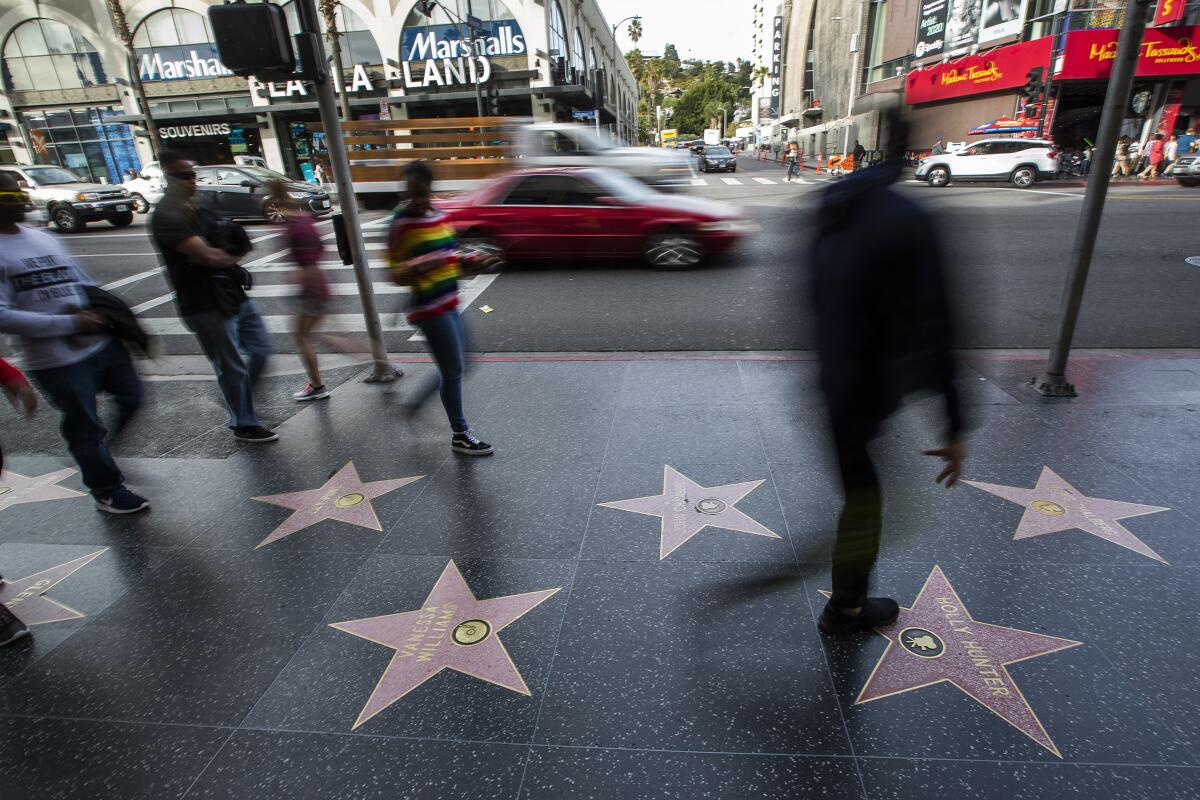 Blurry pedestrians walking on the Walk of Fame