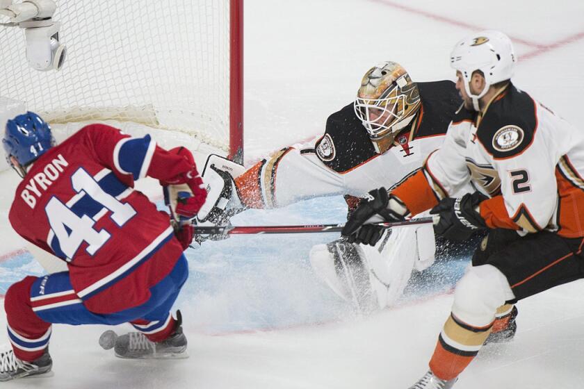 Ducks goaltender Jonathan Bernier (1) makes a save against Montreal Canadiens' Paul Byron (41) as Ducks' Kevin Bieksa (2) defends during the first period on Tuesday.