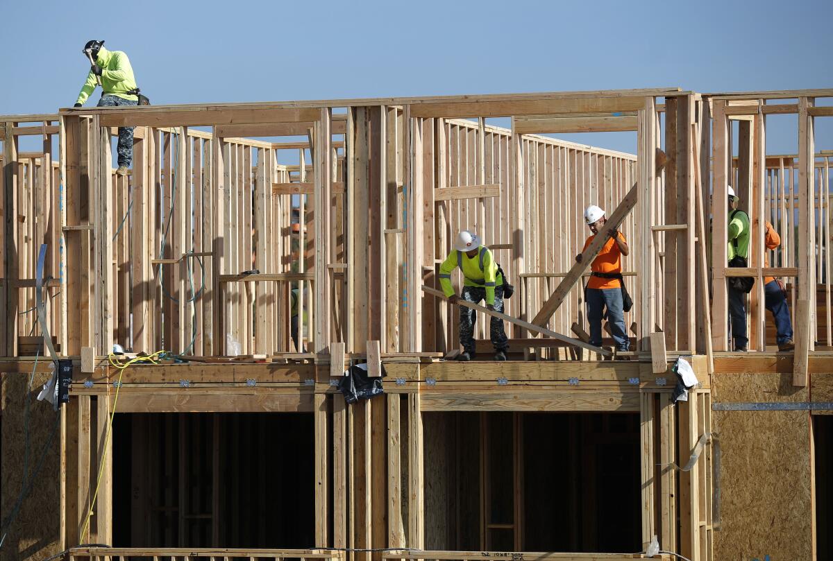 Framers work at the Enclave Otay Ranch Apartments in Chula Vista earlier this year.