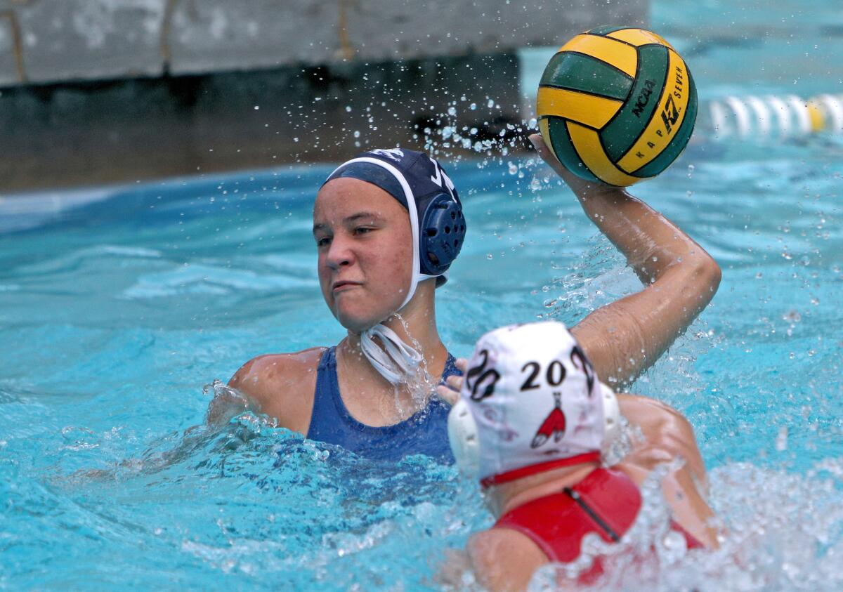 Crescenta Valley High girls water polo player A.J. Troop takes a shot on goal in a Pacific League match Thursday at CV.