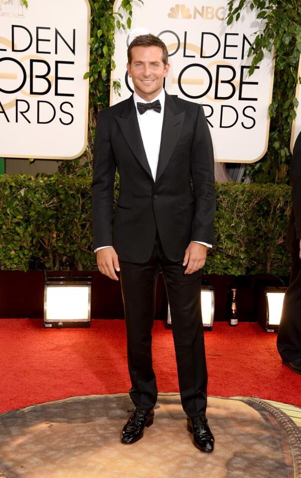 Bradley Cooper, our vote for best-dressed man of the night, wore a black Tom Ford peak-lapel tuxedo, white evening shirt, black bow tie, pocket square and evening shoes.
