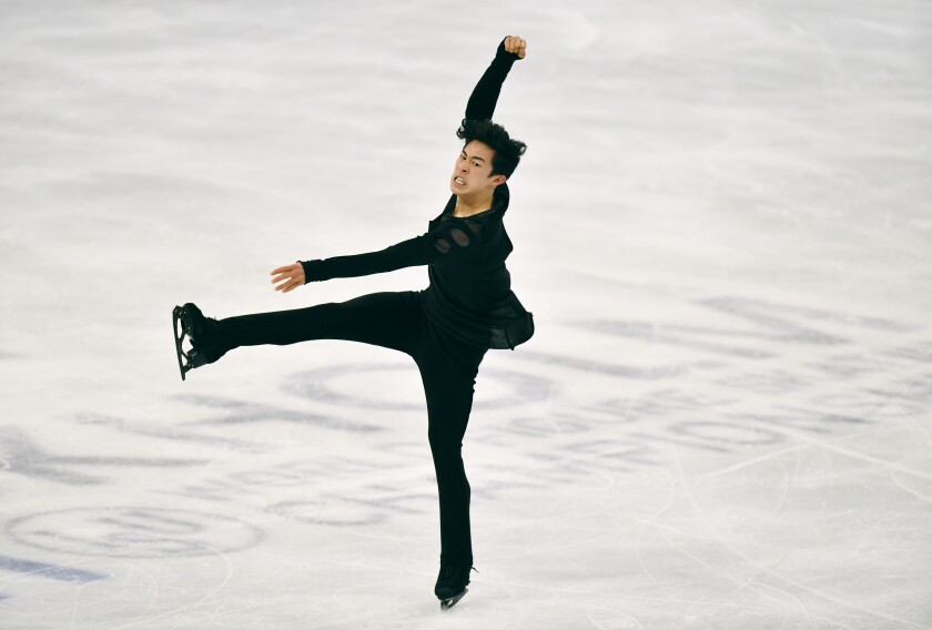 Nathan Chen performs a routine on ice.