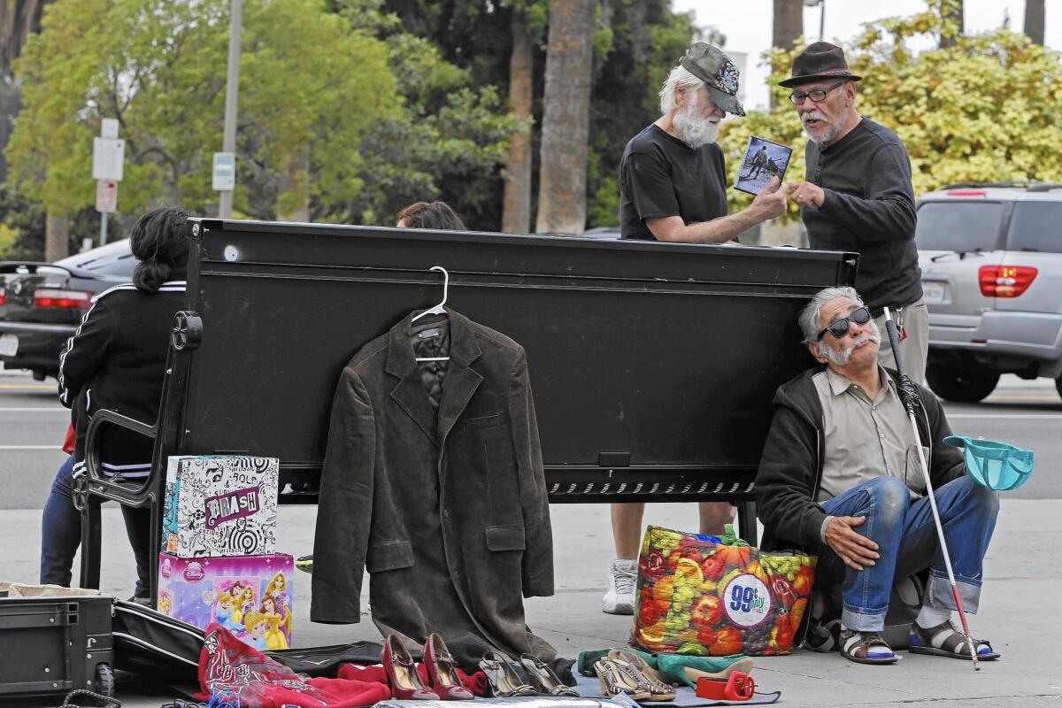 Street vendors like these on Alvarado Street in Los Angeles complain that police aren't issuing receipts for property seized as evidence.