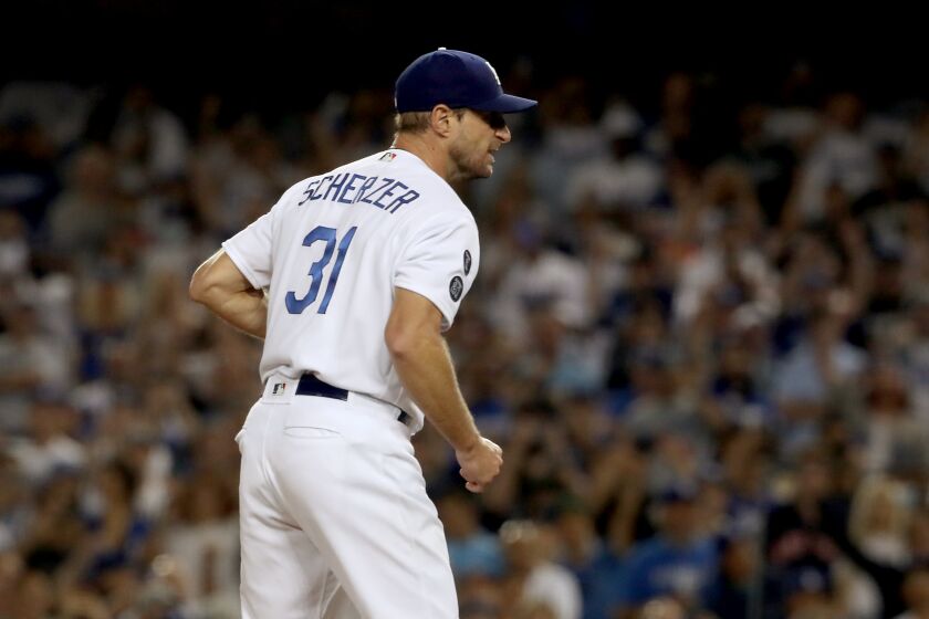 LOS ANGELES, CALIF. - AUG. 4, 2021. Dodgers starter Max Scherzer reacts after closing out the Astros in the seventh inning at Dodger Stadium on Wednesday, Aug. 34, 2021. (Luis Sinco / Los Angeles Times)