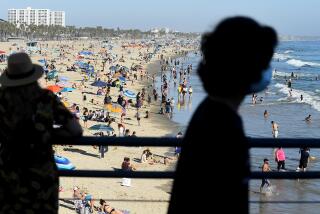 SANTA MONICA, CALIFORNIA AUGUST 1, 2020-People enjoy the hot weather at Santa Monica beach Saturday. (Wally Skalij/Los Angeles Times)