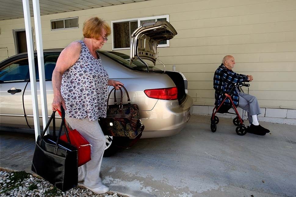 Nita Hoyle evacuates her mobile home in a Camarillo Springs mobile home park along with her 89-year-old father, Harold Ames.
