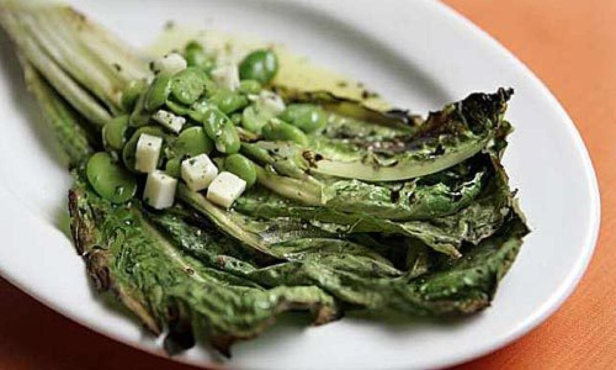 KEEP IT SIMPLE: Grilled romaine with fava beans and pecorino.
