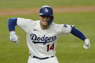 Los Angeles Dodgers' Enrique Hernandez celebrates his home run against the Atlanta Braves during the sixth inning in Game 7 of a baseball National League Championship Series Sunday, Oct. 18, 2020, in Arlington, Texas. (AP Photo/Eric Gay)