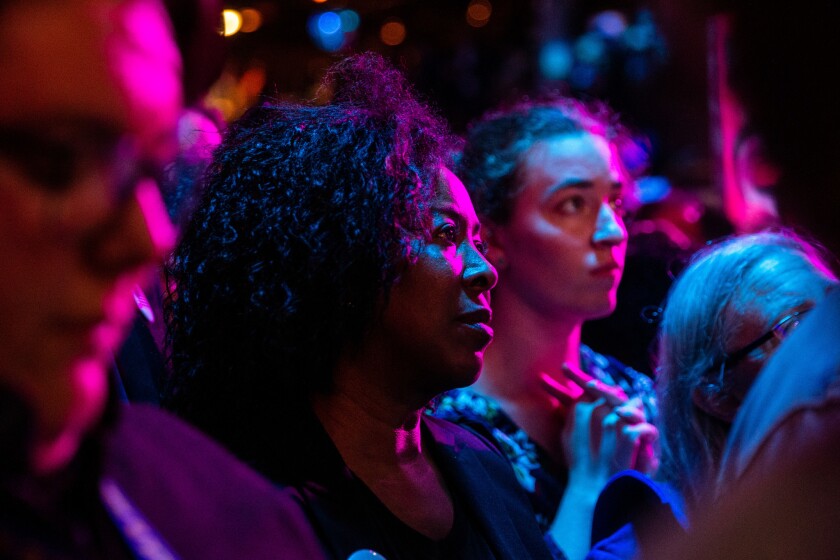 Audience members listen as California Sen. Kamala Harris, a presidential candidate, speaks at the Planned Parenthood party near the Moscone Center where the state Democratic Party convention is underway this weekend.