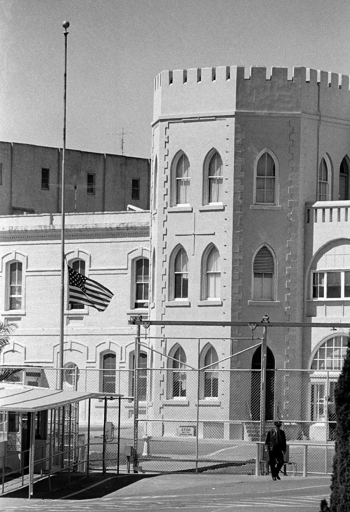 The flag outside the prison walls at San Quentin flies at half mast, Aug. 22, 1971, in honor of three slain guards killed as violence broke out Saturday afternoon. Three guards and three inmates were slain.