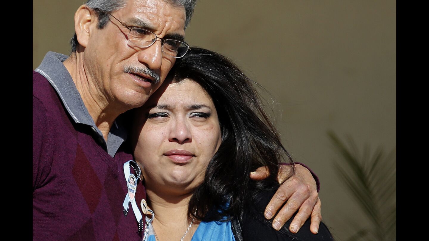 Mourners embrace at the funeral for Aurora Godoy at Calvary Chapel in Gardena on Wednesday. Godoy was one of 14 killed in the attack in San Bernardino on Dec. 2.