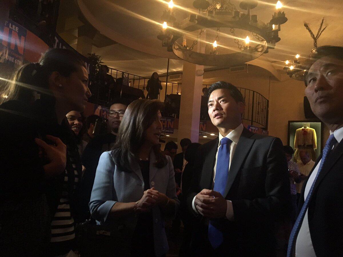 Robert Lee Ahn looks up at a television screen displaying election results Tuesday night.