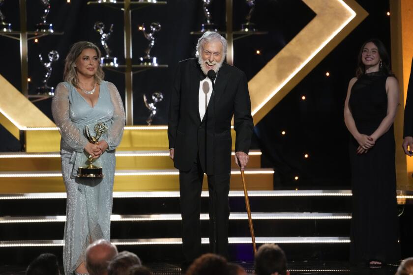 Dick Van Dyke accepts the award for outstanding guest performance in a daytime drama series for "Days of our Lives" during the 51st Daytime Emmy Awards on Friday, June 7, 2024, at the Westin Bonaventure in Los Angeles. Arlene Silver looks on from left.(AP Photo/Chris Pizzello)