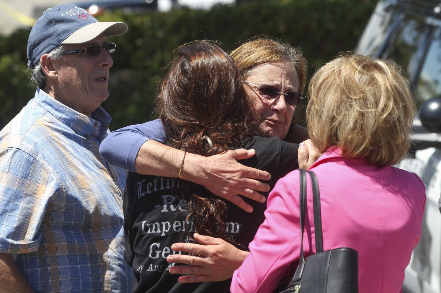 Chabad of Poway members gather outside their synagogue after a man shot multiple people on Saturday, killing one.