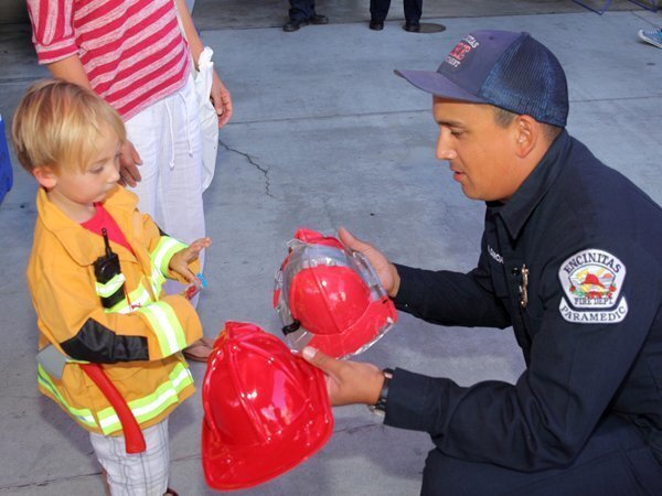 Owen Krauss with Firefighter Marco Garcia