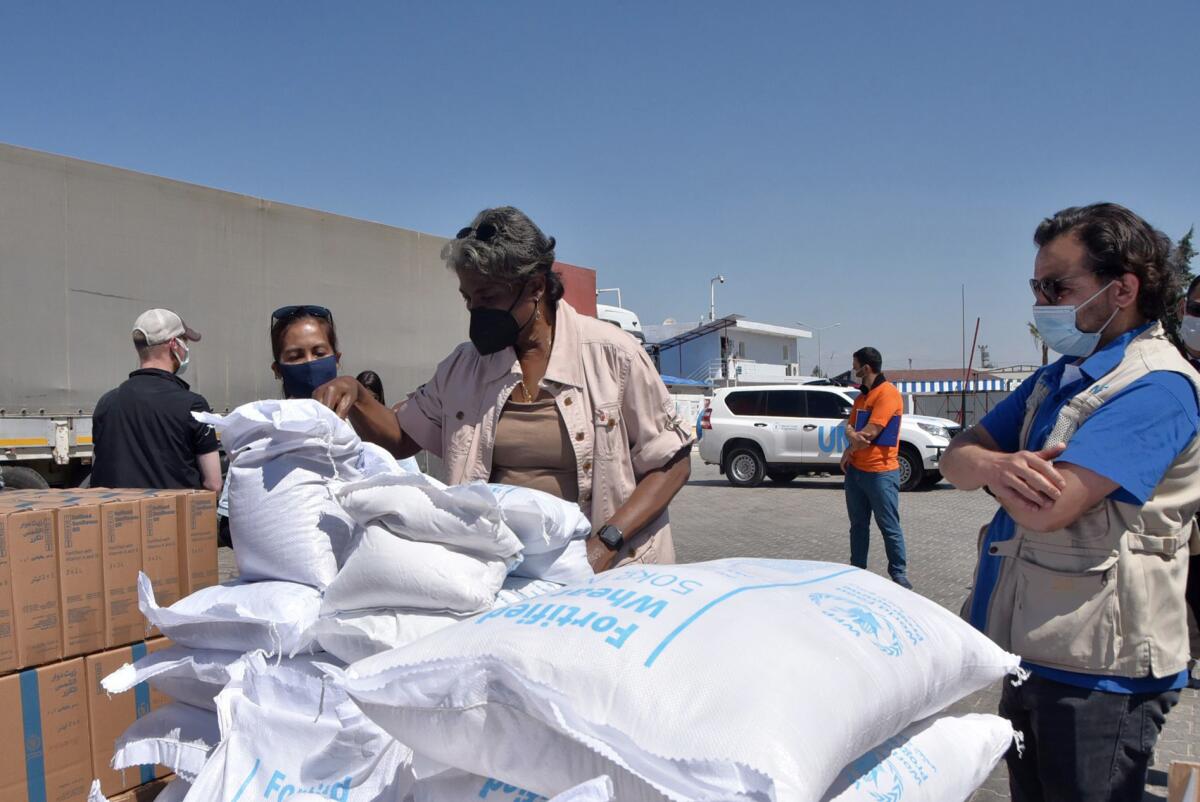 FILE - In this photo provided by the US Embassy in Turkey, Linda Thomas-Greenfield, U.S. Ambassador to the United Nations, examines aid materials at the Bab al-Hawa border crossing between Turkey and Syria, June 3, 2021. Supporters of a one-year extension of humanitarian aid deliveries from Turkey to 4.1 million Syrians in the rebel-held northwest, which Russia vetoed, are calling on Monday, July 11, 2022 for a Security Council vote on Moscow’s proposal for a six-month extension. (US Embassy in Turkey via AP, File)