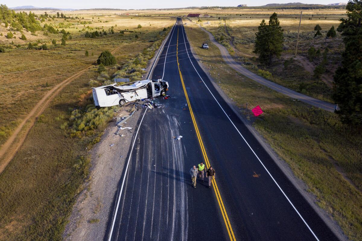 The remains of a bus that crashed while carrying Chinese-speaking tourists lie along State Route 12 near Bryce Canyon National Park, Friday, Sept. 20, 2019, in Utah.