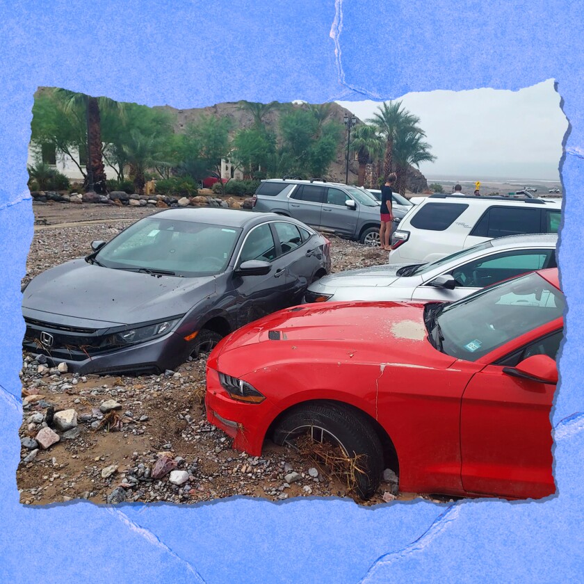 Several cars are buried to the tops of their wheels in mud.
