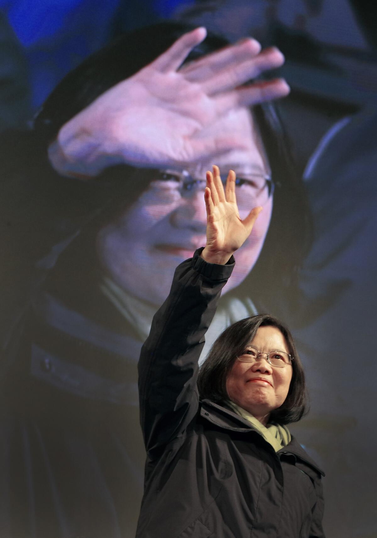 Tsai Ing-wen raises her hands as she declares victory in Taiwan's presidential election Jan. 16, 2016, in Taipei.