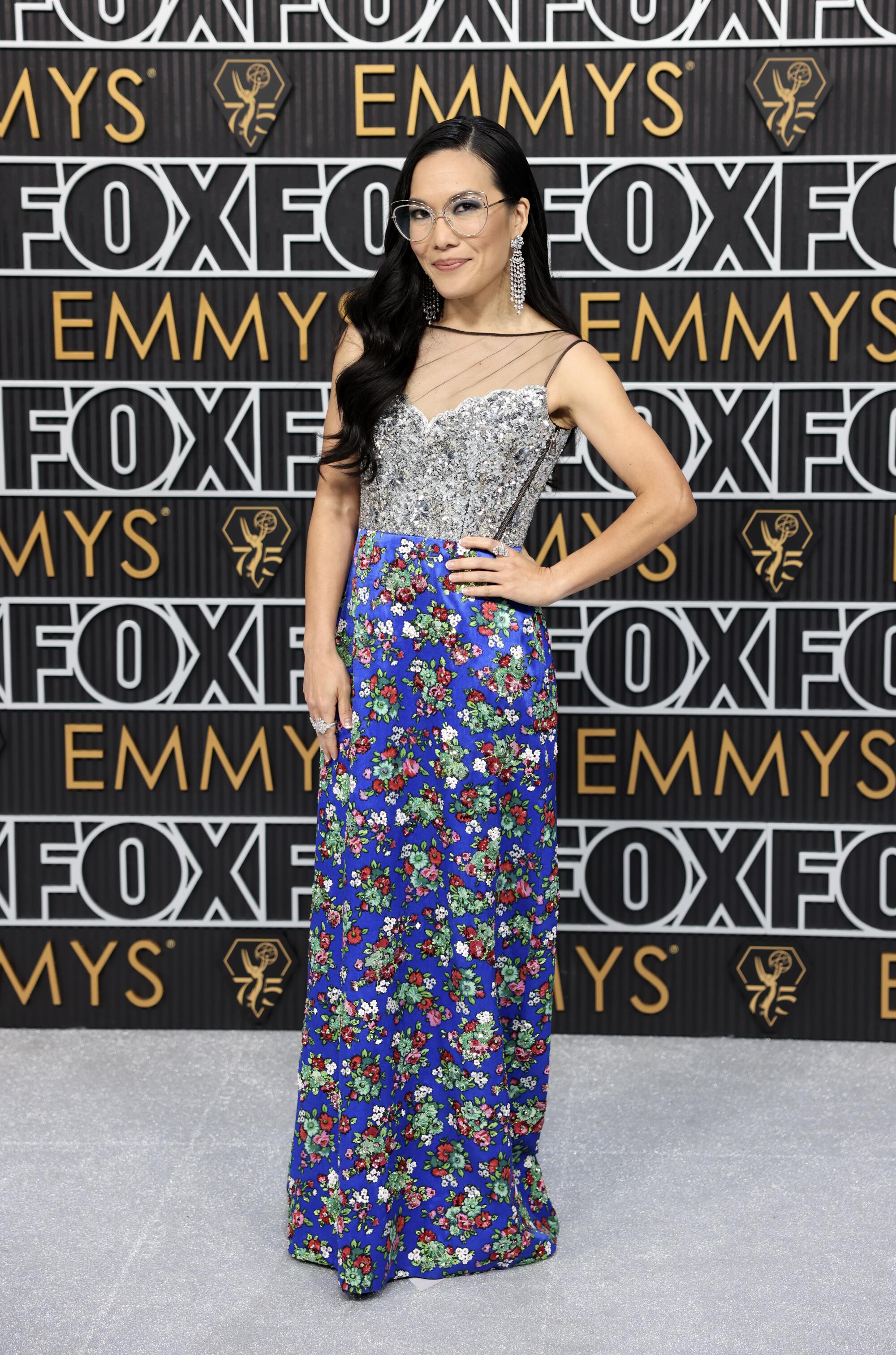 Ali Wong poses on the Emmys red carpet.