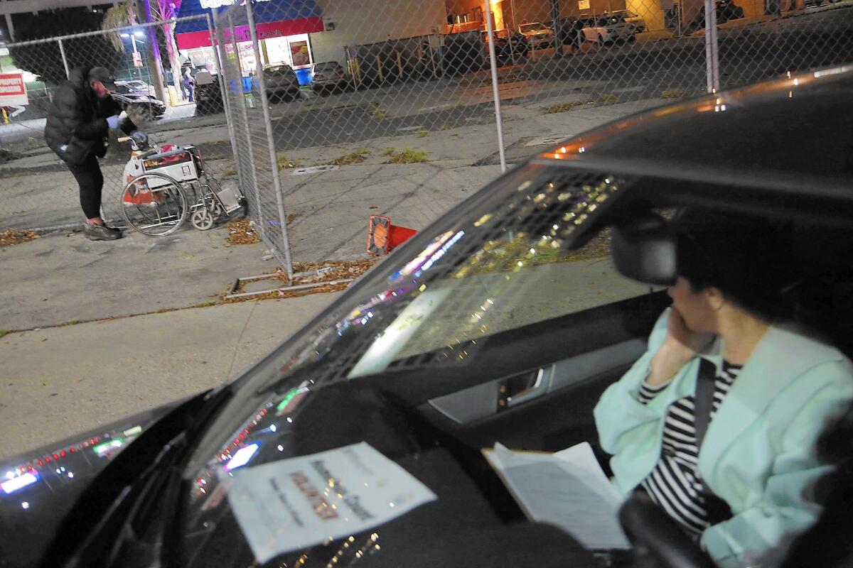 Volunteers will fan out across Los Angeles County over three nights to help the Los Angeles Homeless Services Authority count homeless people. Above, a volunteer with the 2015 homeless count in Brentwood.