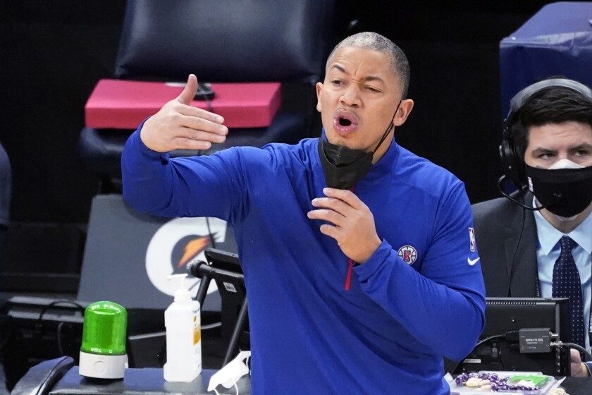 Clippers coach Tyronn Lue motions during a game against the Minnesota Timberwolves.