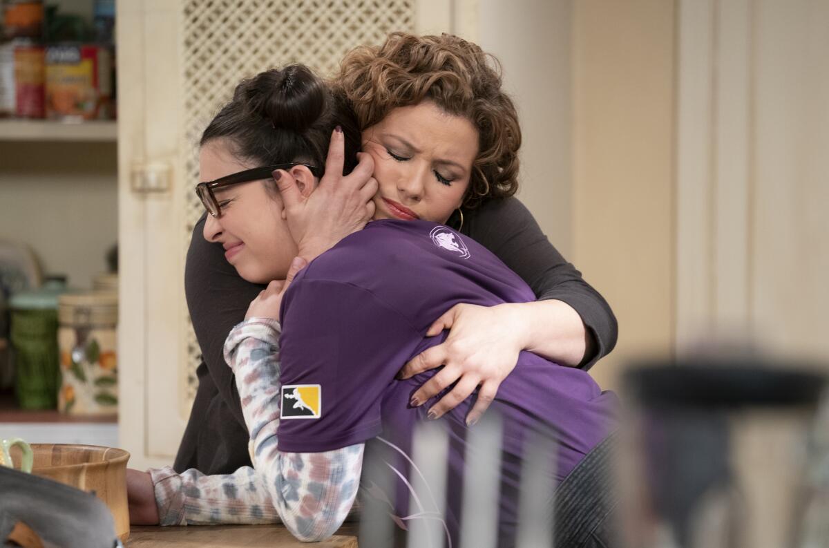 Isabella Gomez and Justina Machado embrace.