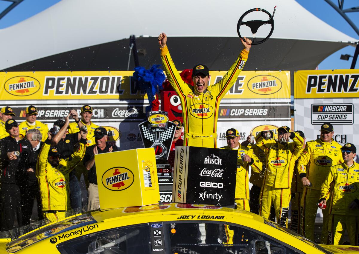 Joey Logano celebrates after winning a NASCAR Cup race at Las Vegas Motor Speedway on Sunday.