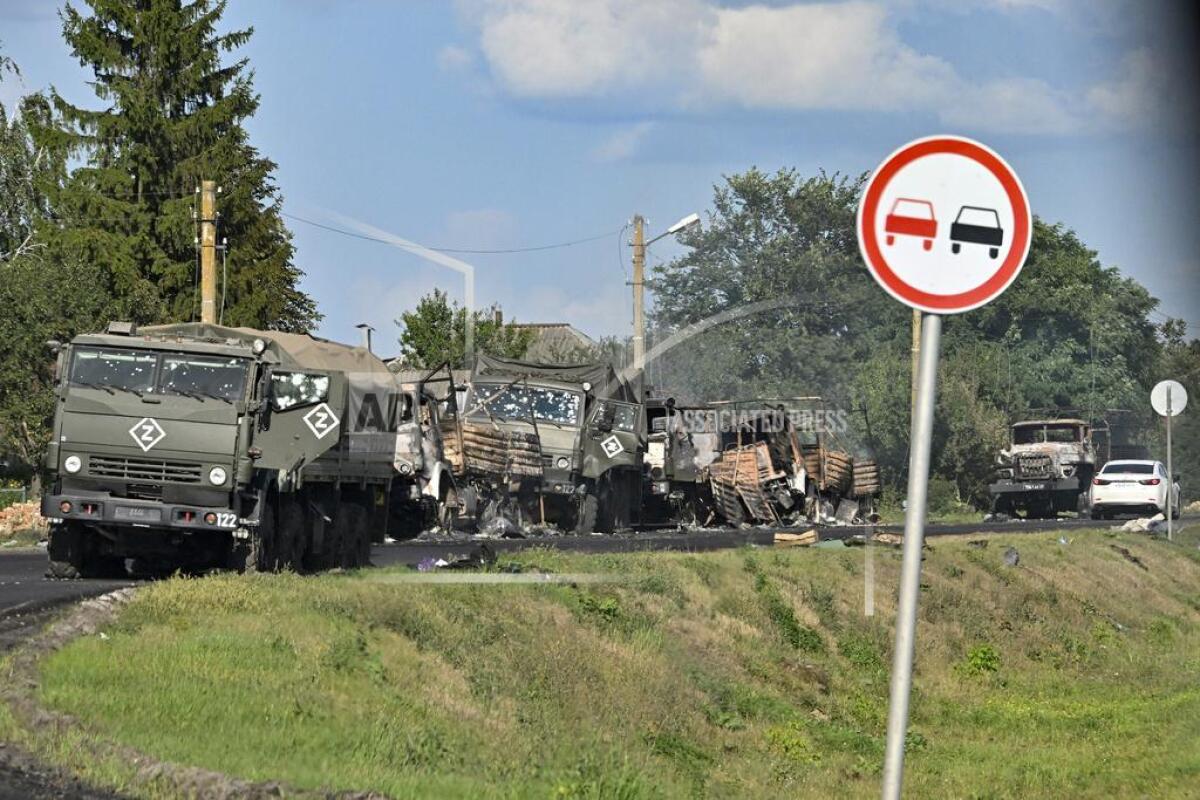 A column of Russian Army trucks damaged by shelling.