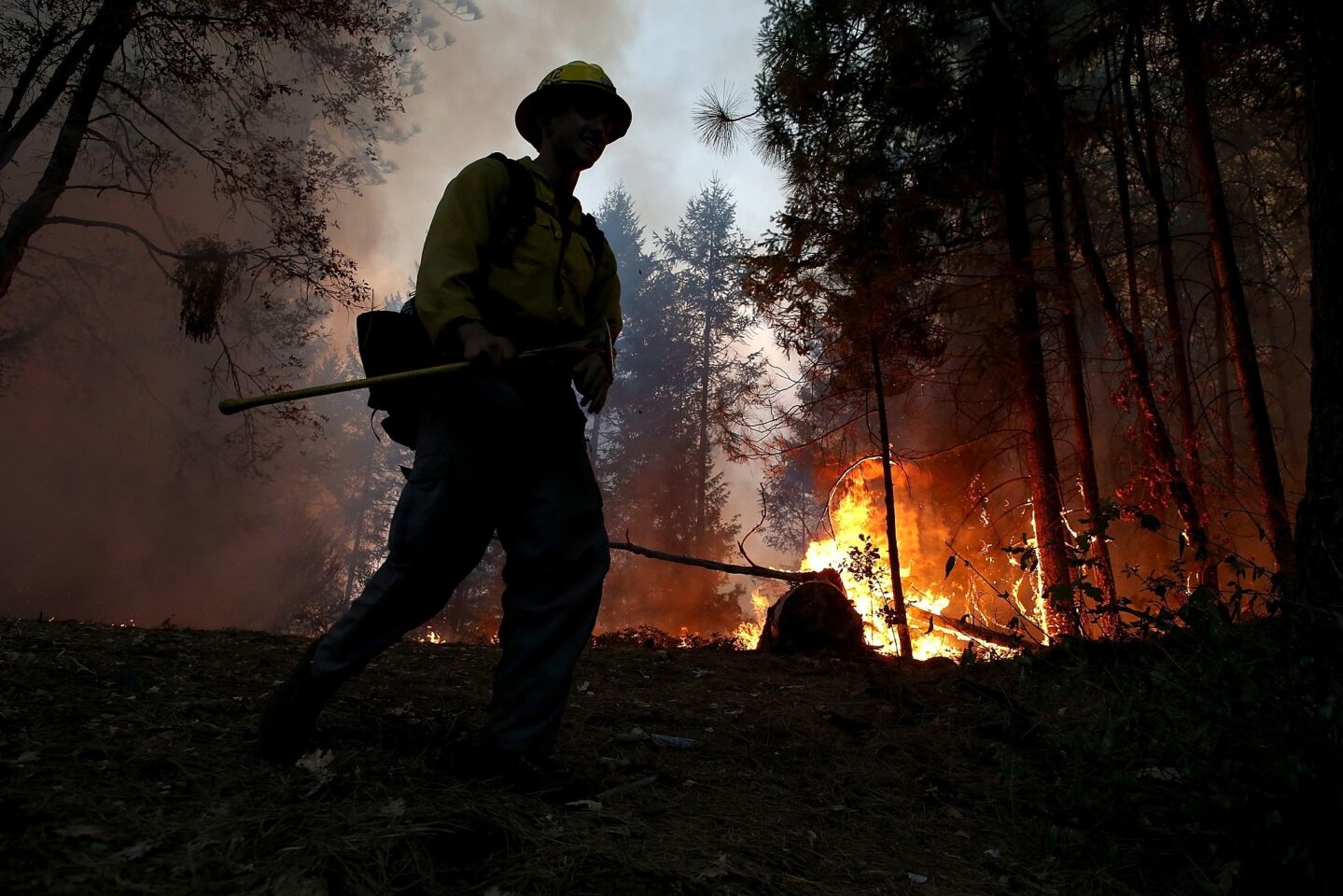 A firefighter monitors the King fire.