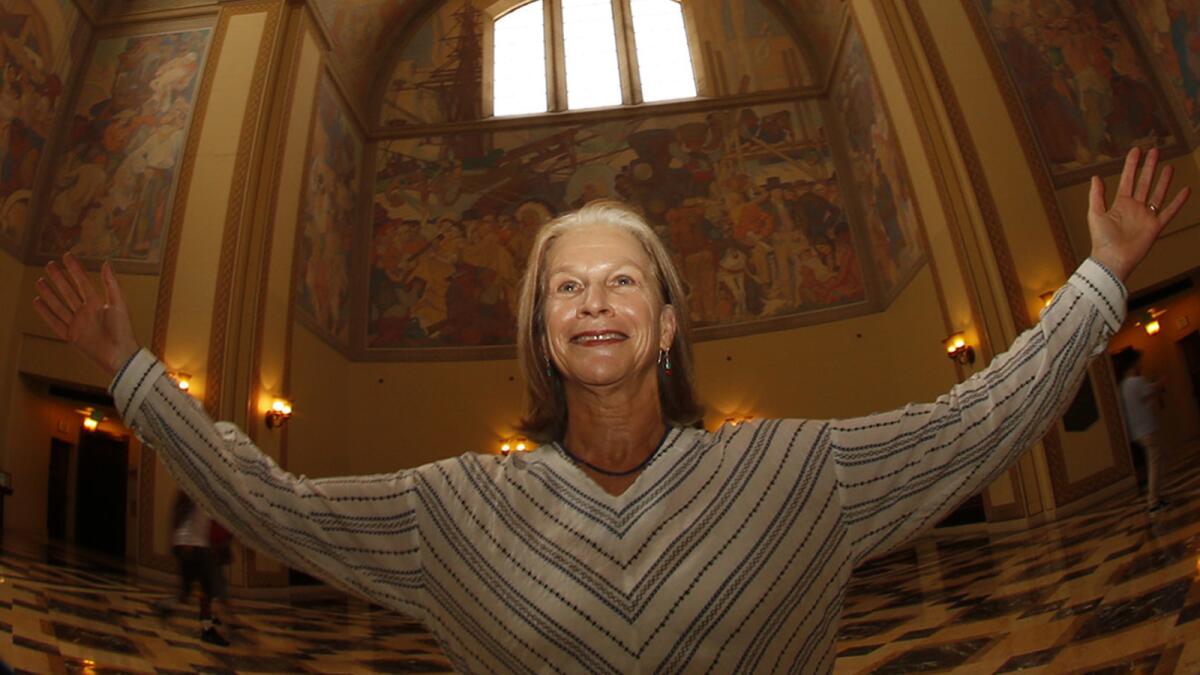 LOS ANGELES, JUNE 15, 2017 -- Louise Steinman, founder and director of the Los Angeles Public Library's ALOUD program, celebrates the "world of literature" in the rotunda of the Los Angeles Public library on June 15, 2017. ALOUD is the Library Foundation of Los Angeles' celebrated literary series of conversations, readings and performances at the downtown Central Library. (Genaro Molina/Los Angeles Times)