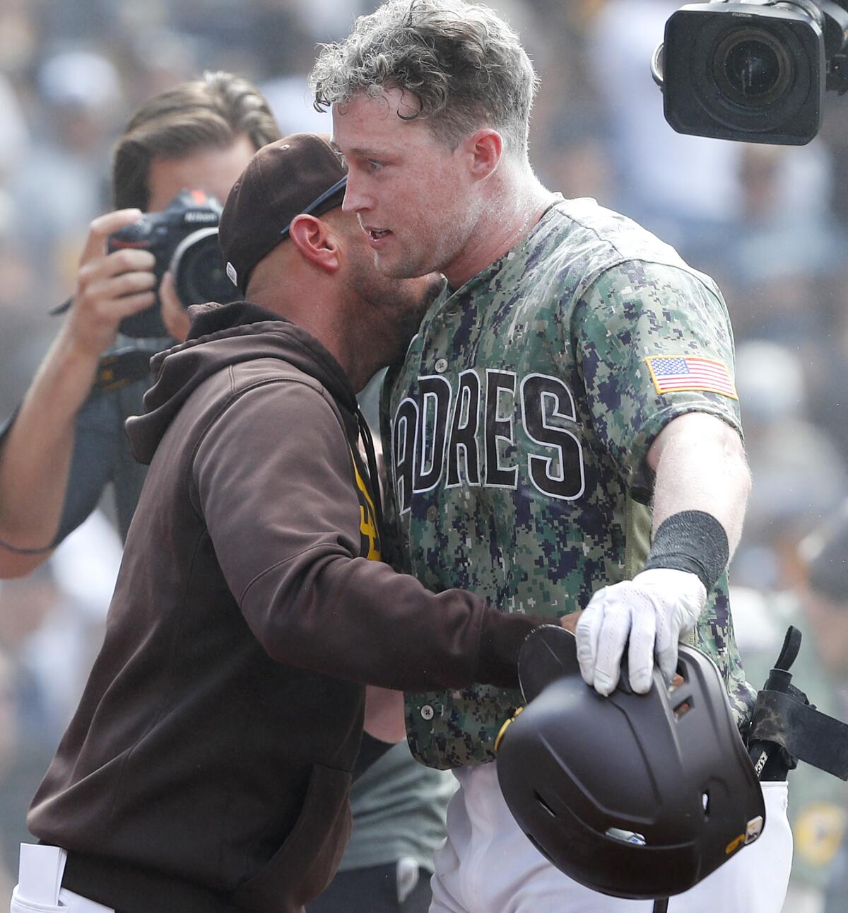 Padres manager Jayce Tingler hugs Jake Cronenworth after he hit a walk-off home run 