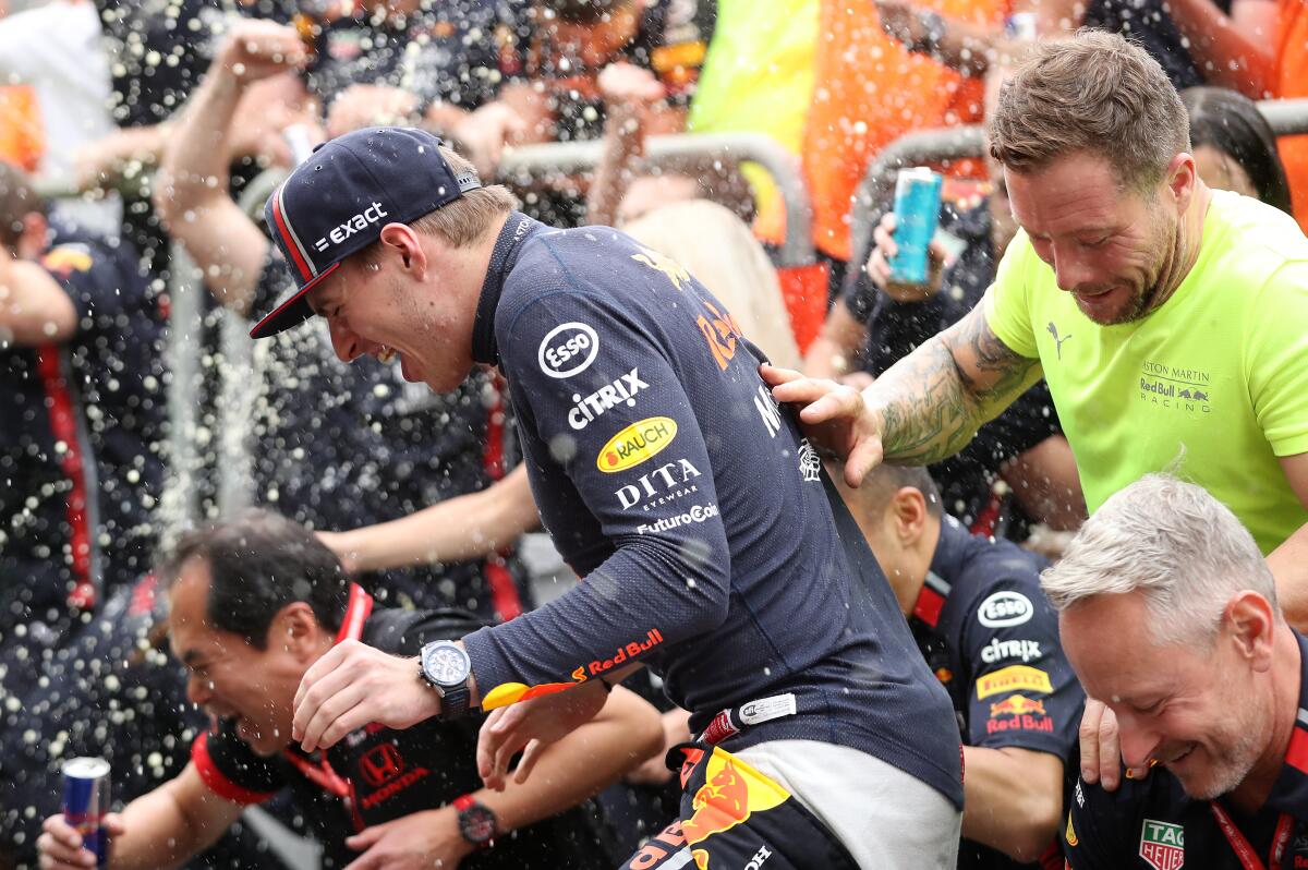 Formula One driver Max Verstappen celebrates with his Red Bull teammates after winning the Brazilian Grand Prix on Nov. 21, 2019.