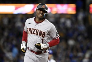 Arizona Diamondbacks' Kyle Lewis heads to third after hitting a two-run home run during the eighth inning of a baseball game against the Los Angeles Dodgers Friday, March 31, 2023, in Los Angeles. (AP Photo/Mark J. Terrill)