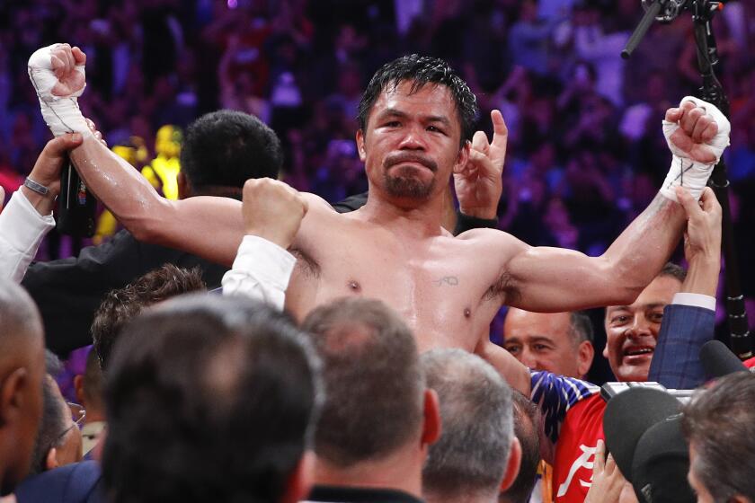 Manny Pacquiao reacts after defeating Keith Thurman by split decision in a welterweight title fight Saturday, July 20, 2019, in Las Vegas. (AP Photo/John Locher)
