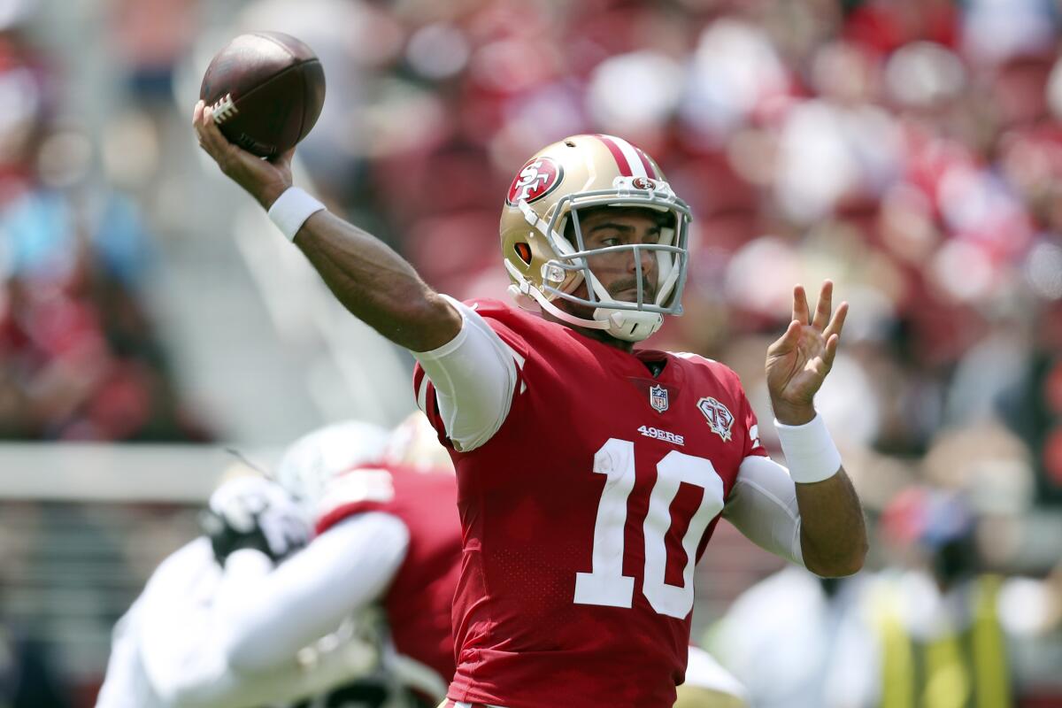 FILE - In this Sunday, Aug. 29, 2021, file photo, San Francisco 49ers quarterback Jimmy Garoppolo (10) throws a pass during an NFL preseason football game against the Las Vegas Raiders in Santa Clara, Calif. Switching personnel mid-drive is commonplace in the NFL with running backs shuttling in and out and teams switching from three-receiver sets to two-receiver formations all the time. The 49ers could do it at quarterback this season with Garoppolo and rookie Trey Lance sharing time. (AP Photo/Jed Jacobsohn, File)