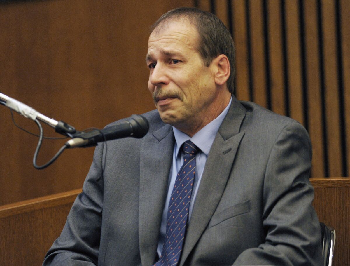 FILE - Ted Wafer, of Dearborn Heights, Mich., testifies in his own defense during his second degree murder trial in Detroit on Aug. 4, 2014. Wafer, who fatally shot a young woman on his porch will get a new sentencing hearing after the Michigan Supreme Court on Wednesday, Feb. 16, 2022, unanimously threw out part of his conviction. (Clarence Tabb Jr./Detroit News via AP, File)