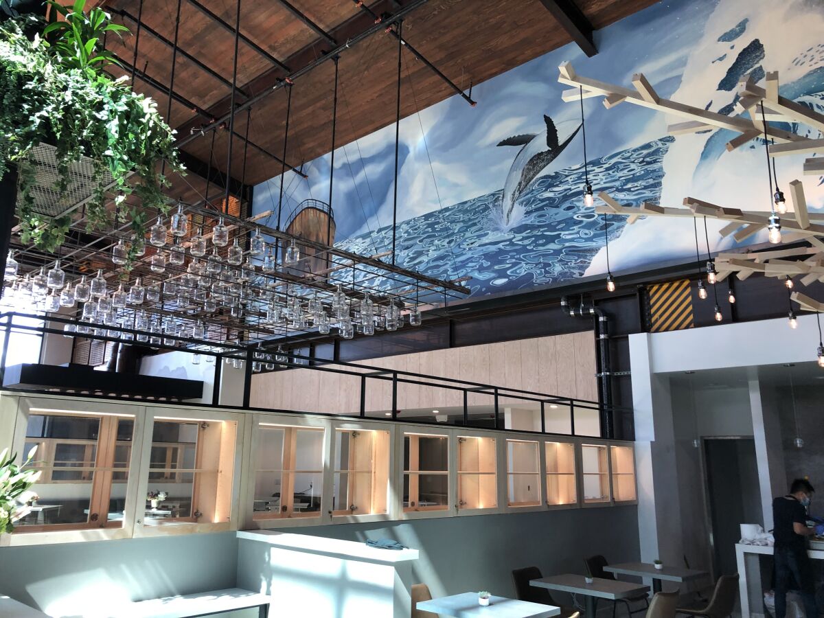 Inside the Sky Deck  food hall at Del Mar Highlands Town Center, an ocean mural can be seen above J restaurant.