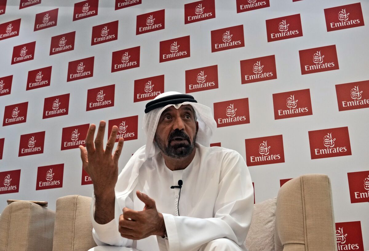 Sheikh Ahmed bin Saeed Al Maktoum, president of the Department of Civil Aviation, CEO and chairman of The Emirates Group speaks with journalists at the Arabian Travel Market exhibition, in Dubai, United Arab Emirates, Tuesday, May 10, 2022. Emirates Air plans to use projected profits from this fiscal year to pay back the Dubai government for some of the roughly $4 billion it pumped into the beleaguered airline during the height of the coronavirus pandemic. (AP Photo/Kamran Jebreili)