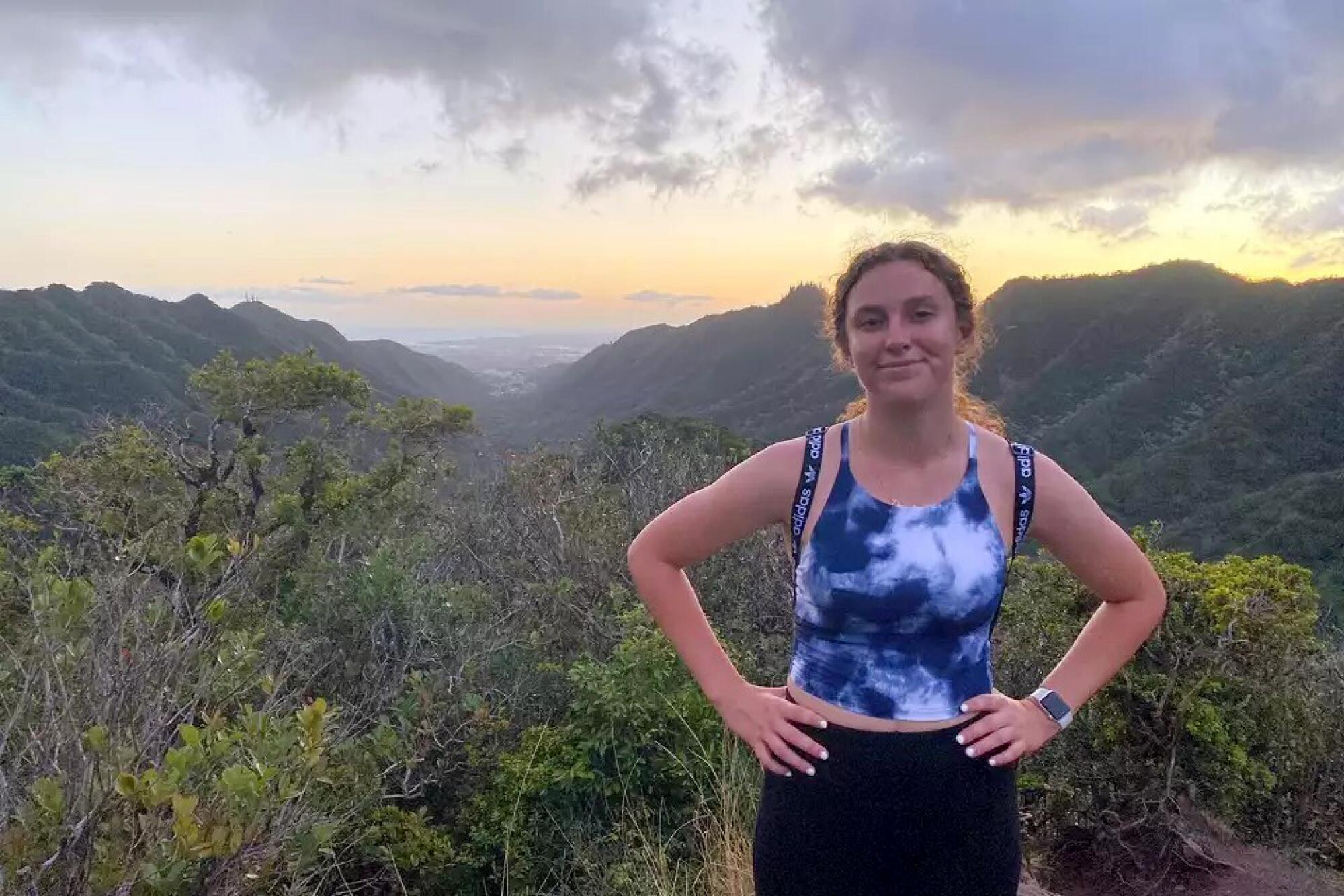 An undated photo of a fit and smiling Grace Rohloff on a mountain hike.   