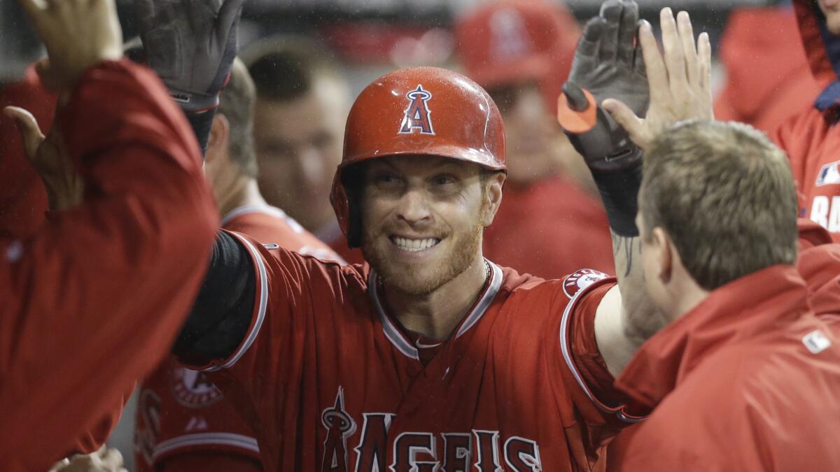 Angels outfielder Josh Hamilton celebrates in the dugout after hitting a solo home run in the eighth inning of Wednesday's 3-2 loss to the Chicago White Sox.