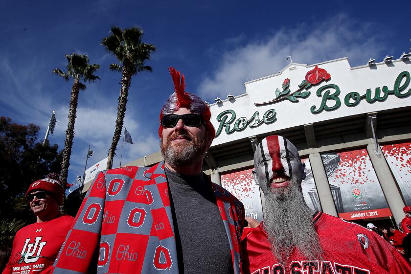 PASADENA, CALIF. - JAN. 1, 2022. Ohio State fans Todd Barhart, 49, left, and MIke Cochran.